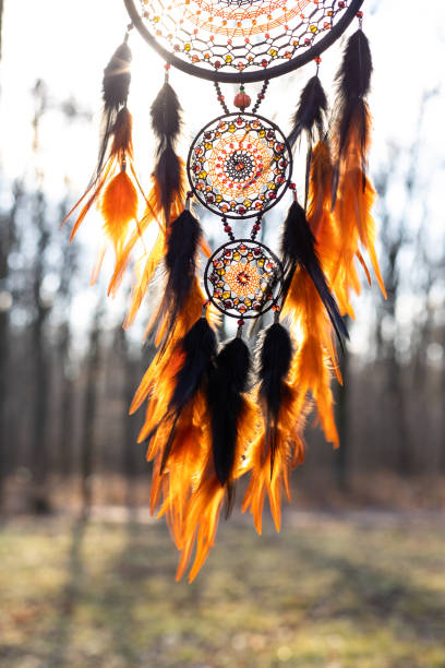 istock Handmade dream catcher with feathers threads and beads rope hanging 1394601093