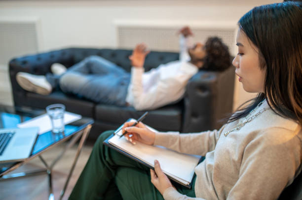 istock Psychoanalyst conducting a mental health assessment of her client 1394601224