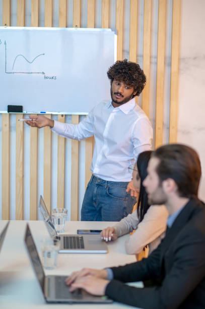 istock Gesticulating office worker giving a presentation to his coworker 1394601254