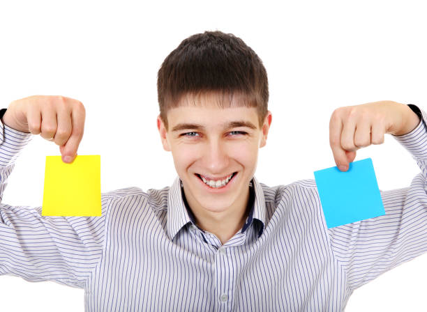 istock Teenager with Two Papers 1394602809