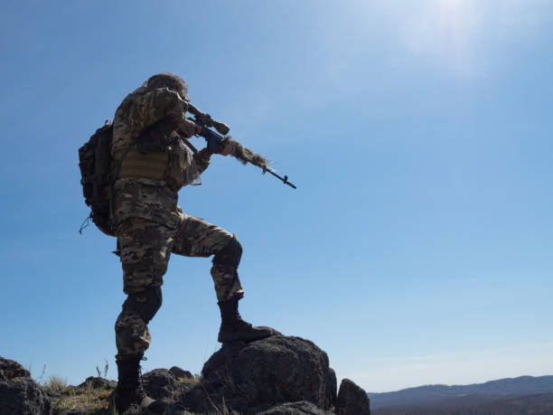 istock Professional special forces sniper during a special operation - he aims at the enemy 1394605169