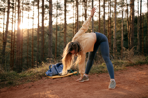 Young woman doing workout routine in nature