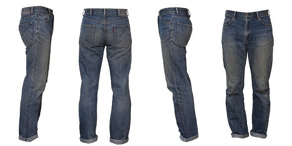 Discolored blue jeans with rolled up hem