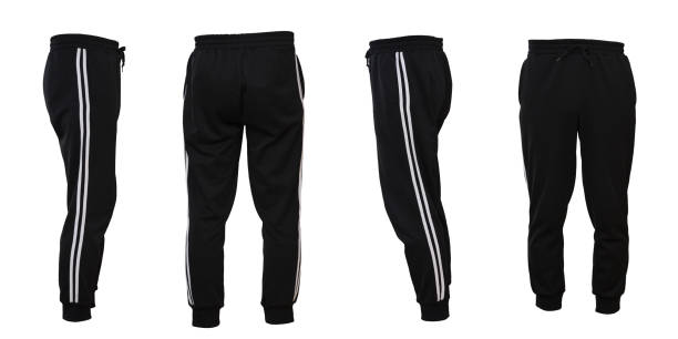 Black track pants with two white lines Black track pants with two white lines on the sides tracksuit stock pictures, royalty-free photos & images