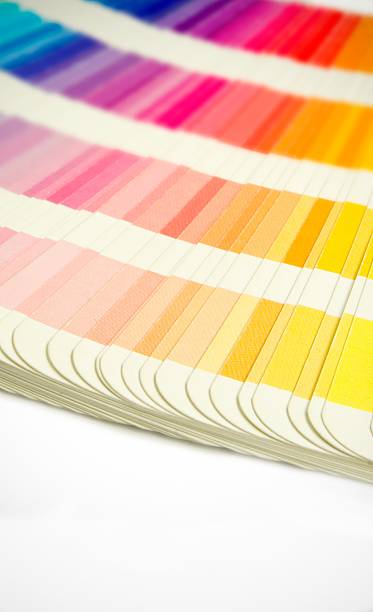 istock Pantone swatches book open showing an array of rainbow colours 139460660