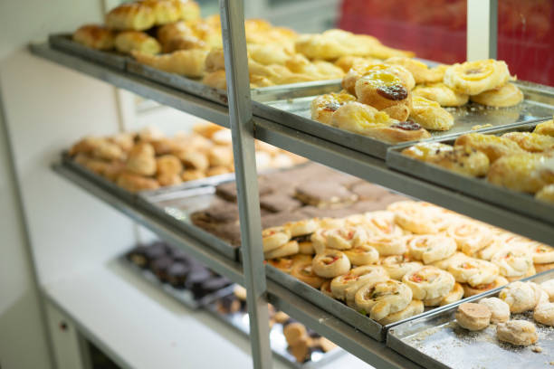 istock Sweet buns on display counter at bakery 1394606841