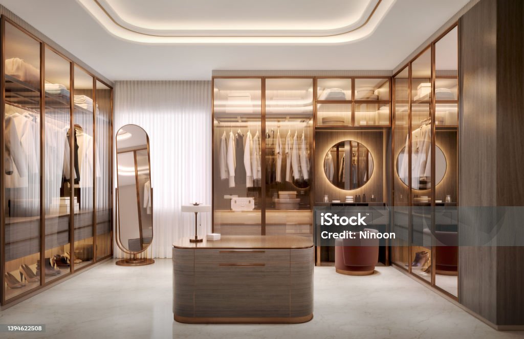 Luxury walk in closet interior with wood and gold elements.3d rendering Closet Stock Photo
