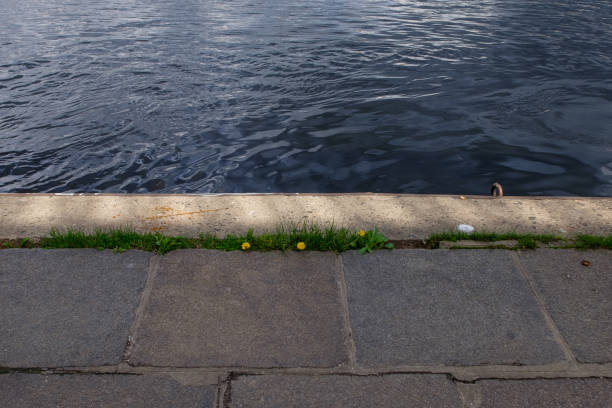 istock ank of the Dnieper River. Waves hit the rocky shore 1394624912
