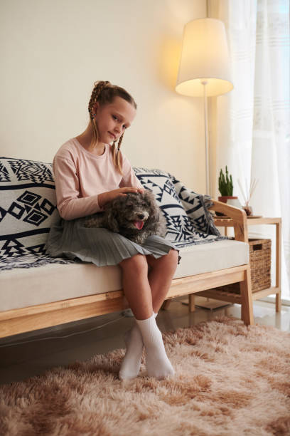 istock Girl with Small Dog 1394625595