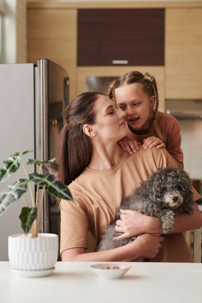 istock Mother, Daughter and Small Dog 1394625614