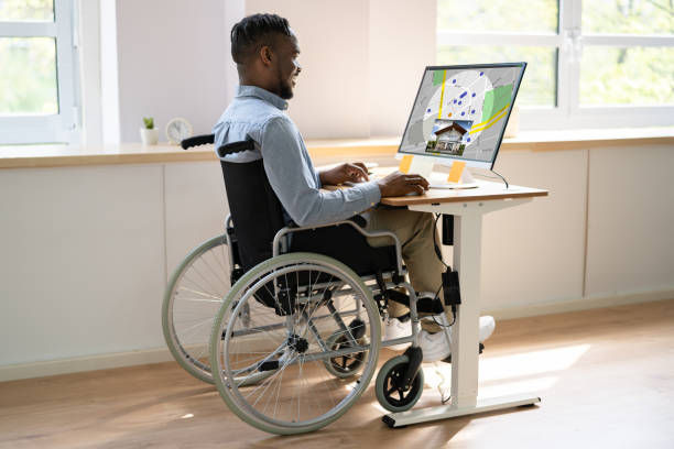 istock Worker In Wheelchair Searching For Real Estate On Computer 1394627853