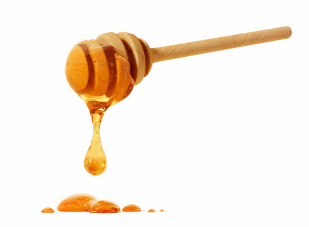 istock Honey dipper with honey 1394629063