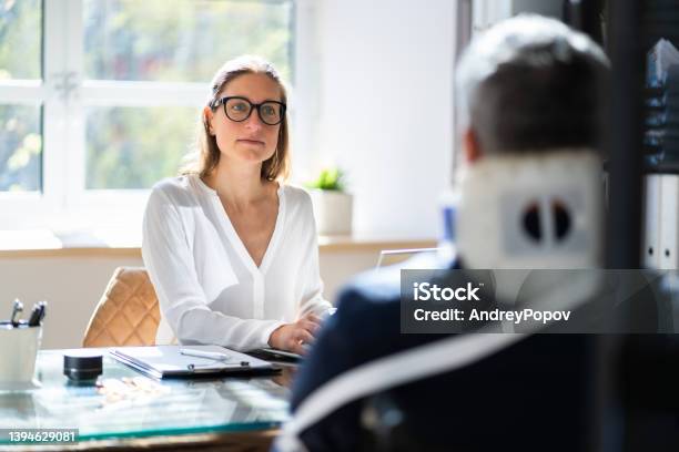 Compensation Money And Litigation Stock Photo - Download Image Now - Lawyer, Physical Injury, Disability