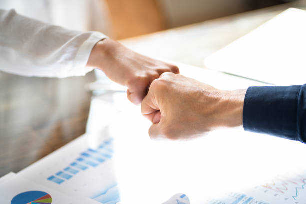 istock Financial Graph And Diagram. Analyst Fist Bump 1394629152
