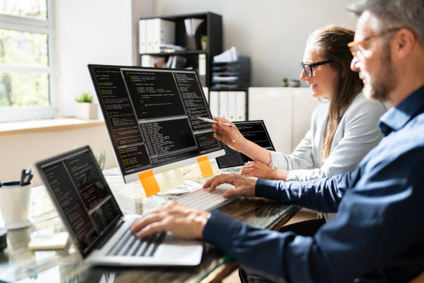 Agile Pair Programming And Extreme Coding Agile Pair Programming And Extreme Coding. Business Software debugging photos stock pictures, royalty-free photos & images