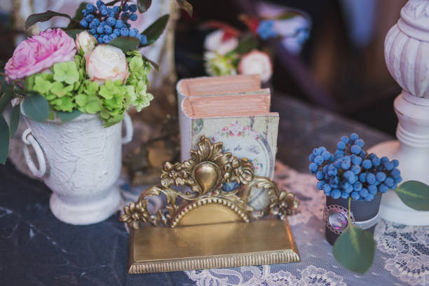 istock Floral composition with blueberries and vintage book on the table at wedding reception 1394630135