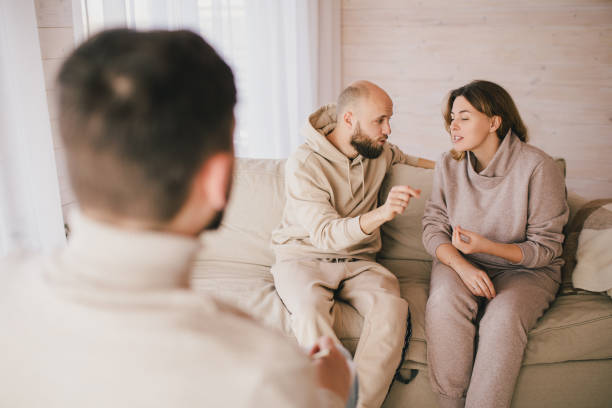 istock Psychiatrist consulting couple that have problems in their relationship. Mental support session. 1394633744