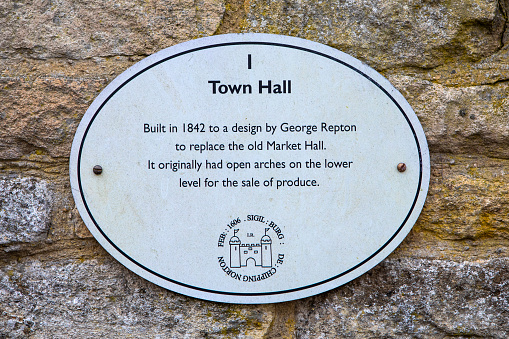 Chipping Norton, UK - April 10th 2022: Plaque on the exterior of the Town Hall in the market town of Chipping Norton in Oxfordshire, UK.