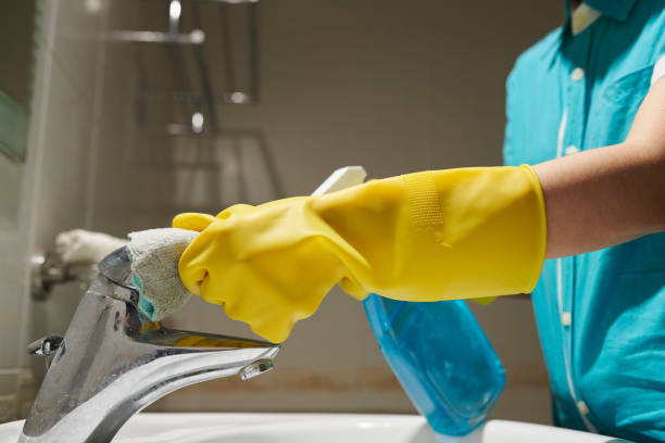 istock Maid Cleaning Water Tap 1394635920