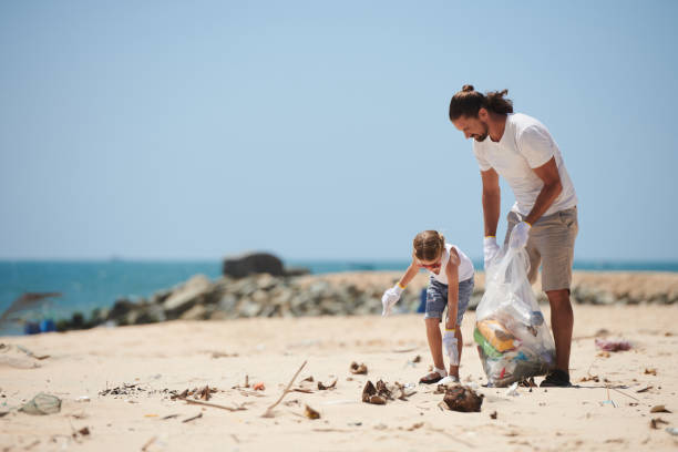istock Family Cleaning Beach 1394636429