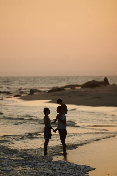 istock Family on Beach at Sunset 1394637030