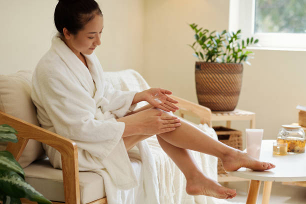 istock Woman Applying Moisturizing Lotion 1394637074