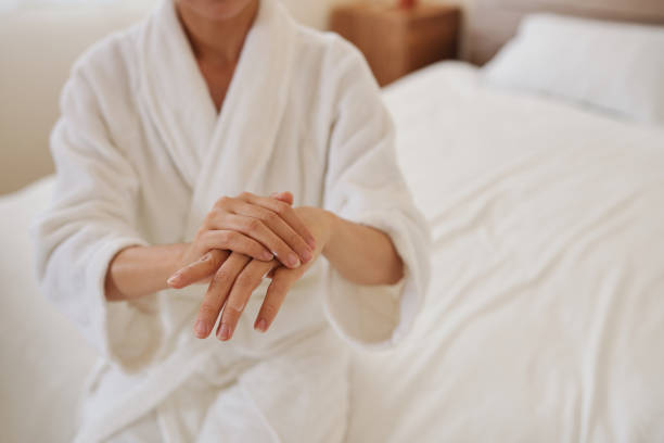 istock Woman Applying Hand Cream 1394637129