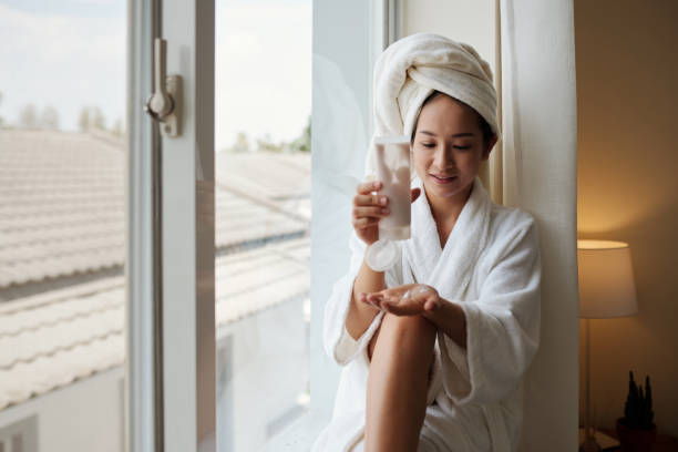 istock Woman Applying Body Lotion 1394637130