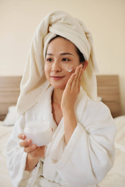 istock Woman Applying Night Face Mask 1394637138