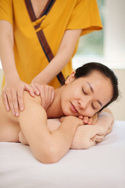 istock Woman Enjoying Back Massage 1394637191