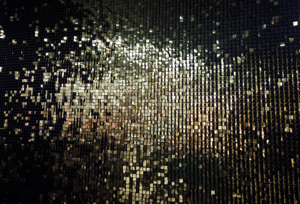 istock Black background with shiny golden scales.Festive background 1394641620