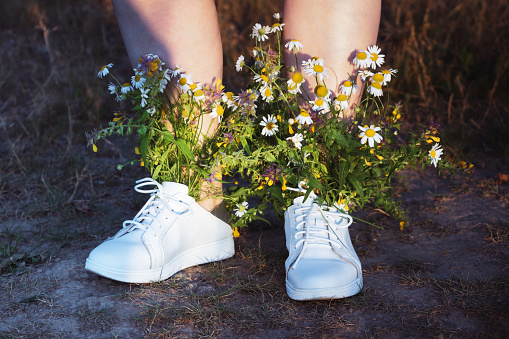 women white boots with bouquet flower iside