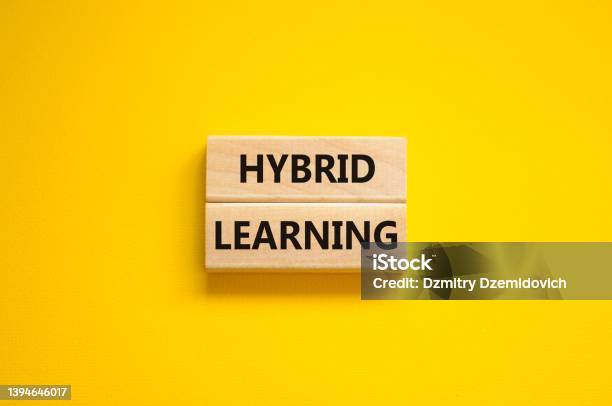 Hybrid Learning Symbol Concept Words Hybrid Learning On Wooden Blocks On A Beautiful Yellow Background Business Educational And Hybrid Learning Concept Copy Space Stock Photo - Download Image Now