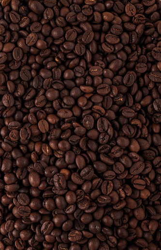 Brown roasted coffee beans close up macro shots