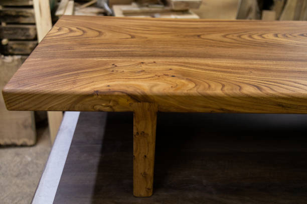 istock Newly-made brown wooden table in the workshop 1394648146