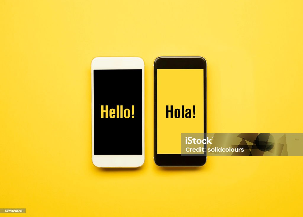 Hello Hola Hello and hola in smart phones. Spanish Language Stock Photo