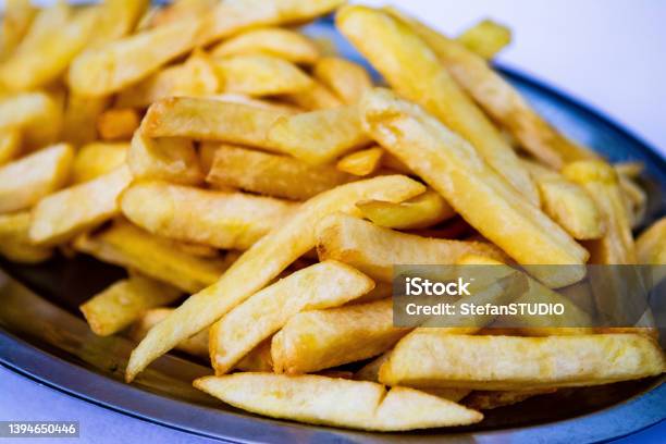 Serving Size Of Famous Fast Food French Fries Stock Photo - Download Image Now - Fast Food French Fries, Plate, American Culture