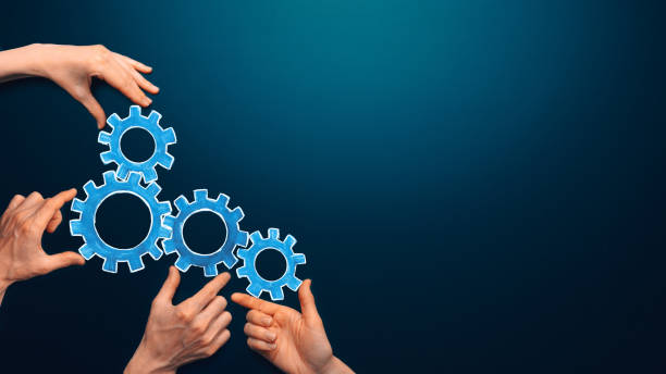 istock Teamwork concept. team connects gear parts. Idea of partnership, cooperation, team work. Metaphor for joining a partnership as diverse gears connected together as a corporate symbol for cooperation and working collaboration. Copy space 1394651436