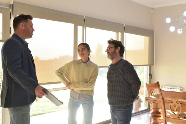 istock real estate seller showing a house 1394654880