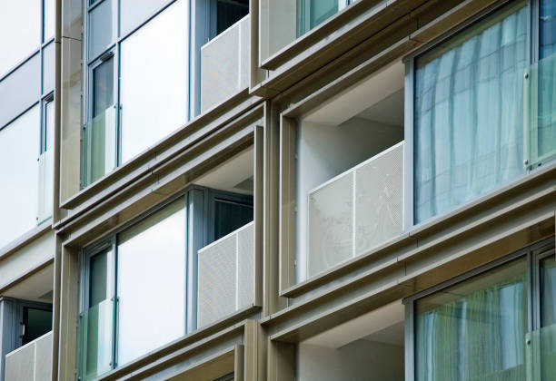 istock Architectural details of modern office building with reflections. 1394658595