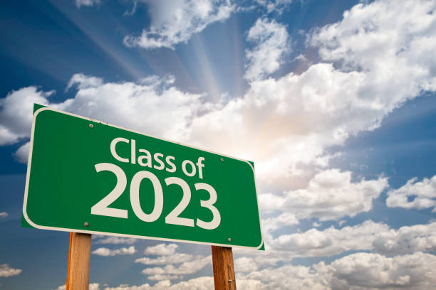 istock Class of 2023 Green Road Sign with Dramatic Clouds and Sky 1394662480