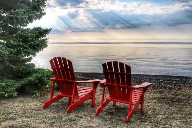 istock Chairs by the lake 1394663056