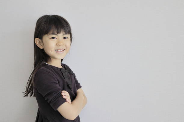 istock Japanese girl folding her arms (7 years old) 1394663862