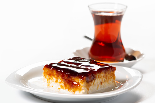Cherry trilece dessert on white background. Dessert concept with Turkish tea.