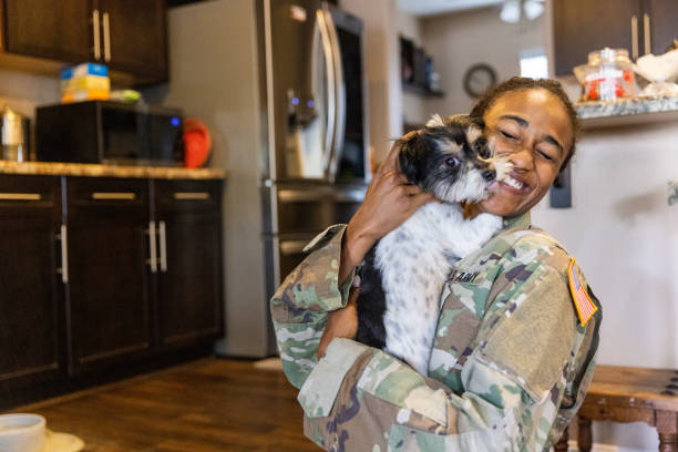 istock US Army Servicewoman hugging her dog 1394667431