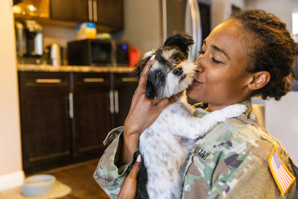 istock US Army Servicewoman hugging her dog 1394667434