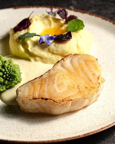 Cod fillet with micro greenery and sauce