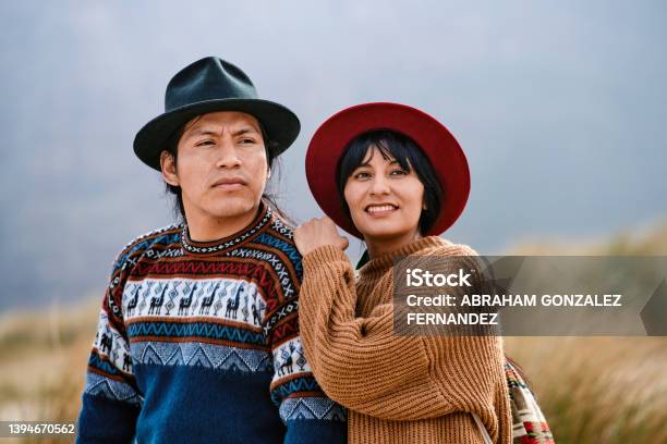 Portrait Of Indigenous Couple Dressed In Their Traditional Clothes From Their Country Looking Away Stock Photo - Download Image Now