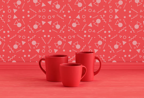 istock Solid red three coffee mugs side by side on monochrome red kitchen countertop front of red decorative wall, front view, 3d rendering, no people 1394673983
