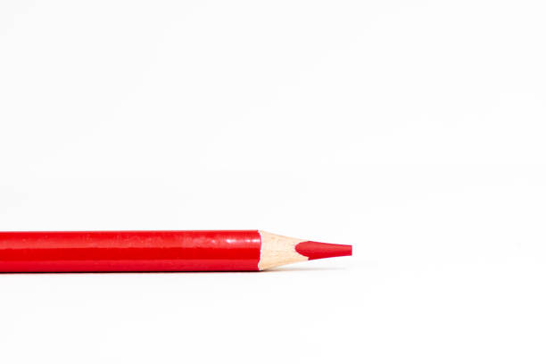 istock New bright red colored pencil laying horizontally 1394674873